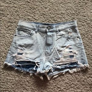 Light blue ripped denim shorts